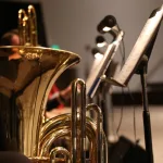 brass trumpet in grayscale photography